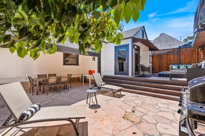 an outdoor patio with chairs and a table at Bel Air Very Private and Comfy Home with Jacuzzi in Los Angeles