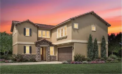 a house with a sunset in the background at Marbella Lane Spacious 4BR Modern Family Home in Placentia