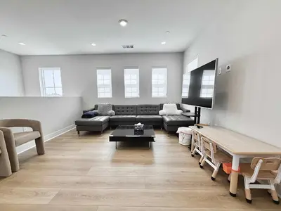 a living room with a couch and a tv at Marbella Lane Spacious 4BR Modern Family Home in Placentia