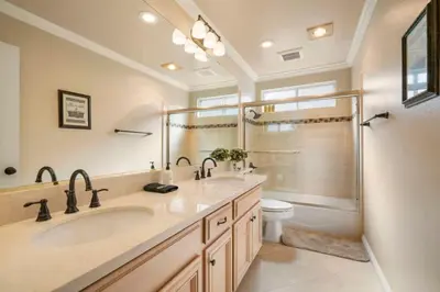 a bathroom with a sink and a shower and a toilet at Marbella Lane - Captivating Home w Pool in Rowland Heights
