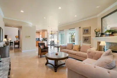 a living room with couches and a table in a room at Marbella Lane - Revitalizing Getaway w Pool in Rowland Heights