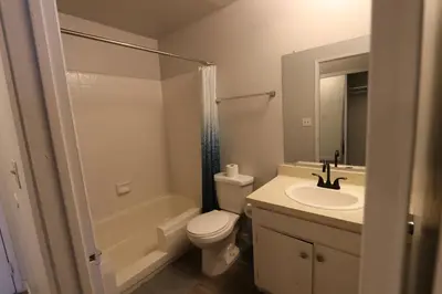 a bathroom with a toilet and a sink and a shower at Nice Queed bed apt in Beverly Hills neighborhood in Los Angeles