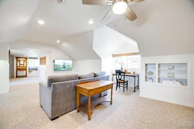 a living room with a couch and a table at Spacious Riverside Farmhouse, Perfectly Located in Riverside