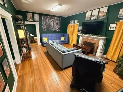 a living room with a couch and a fireplace at Larchmont 1875 sq ft house 3 bed 2 bathroom in Los Angeles