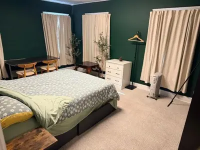 a bedroom with a bed and a table and a desk at Larchmont 1875 sq ft house 3 bed 2 bathroom in Los Angeles