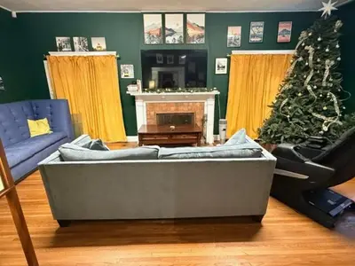 a living room with a couch and a christmas tree at Larchmont 1875 sq ft house 3 bed 2 bathroom in Los Angeles