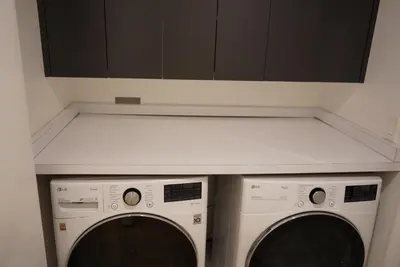 a kitchen with two washing machines and a counter at The Hollywood House in Los Angeles
