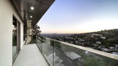 a view from the balcony of a house at Hollywood Hills 6BR Luxury Home w Pool, Theater & Panoramic Views in Los Angeles