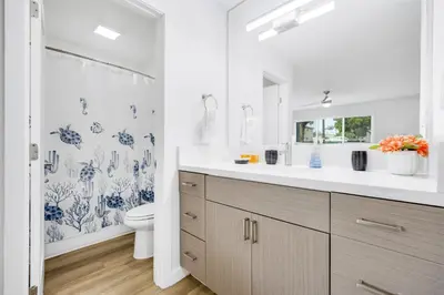 a white bathroom with a sink and a toilet at Oneluxstay Near Redondo Beach in Redondo Beach