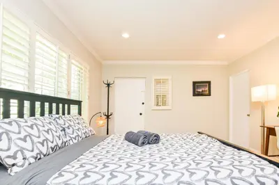 a bedroom with a large bed with a large window at Large Room with Private Entrance in Beverly Hills - BRB1 in Los Angeles