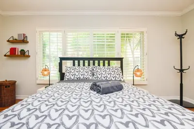 a bedroom with a large bed with a large window at Large Room with Private Entrance in Beverly Hills - BRB1 in Los Angeles