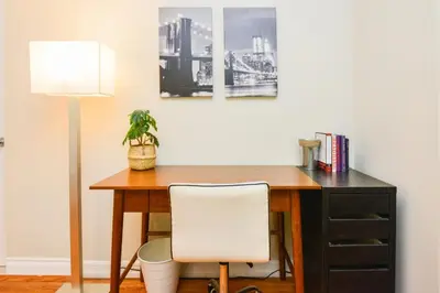 a desk with a white chair and a lamp at Large Room with Private Entrance in Beverly Hills - BRB1 in Los Angeles