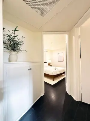 a bedroom with a bed and a potted plant at 2BR Bohemian Haven Near Walk of Fame - BR6 - BUR in Burbank
