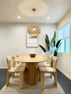 a dining room with a wooden table and chairs at 2BR Bohemian Haven Near Walk of Fame - BR6 - BUR in Burbank