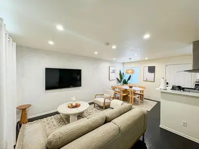 a living room with a couch and a table at 2BR Bohemian Haven Near Walk of Fame - BR6 - BUR in Burbank