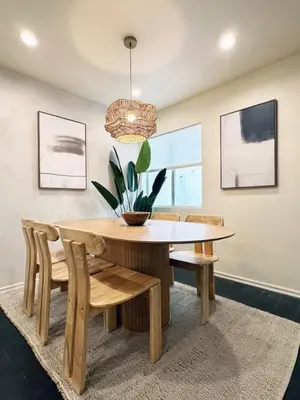 a dining room with a table and chairs and a potted plant at 2BR Bohemian Haven Near Walk of Fame - BR6 - BUR in Burbank