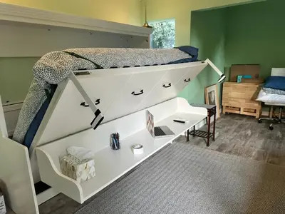 a bedroom with a bunk bed with a white desk at No Ho Casita in North Hollywood