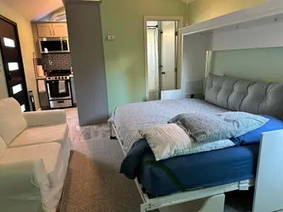 a bedroom with a bed and a couch at No Ho Casita in North Hollywood