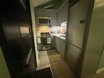 a small kitchen with a stove and a refrigerator at No Ho Casita in North Hollywood