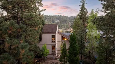 a house in the woods with trees at Lakeview Bear Cubs Den - Walk to Lake, Close to Slopes in Big Bear Lake