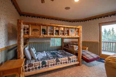 a bedroom with a bunk bed in a room at Foster’s Cabin - Close to Lake and Slopes in Big Bear City