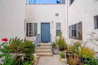 a house with a blue door and some plants at Private Guesthouse Studio Near Echo Park in Los Angeles