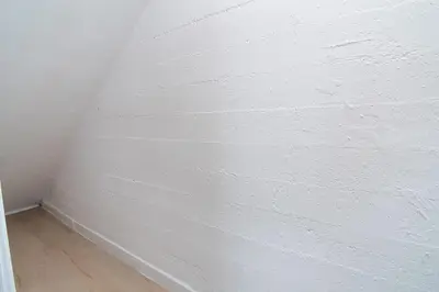 a white brick wall in a corner of a room at Private Guesthouse Studio Near Echo Park in Los Angeles