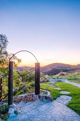 a golf course with a view of the hills at Mintcello Estate in Malibu