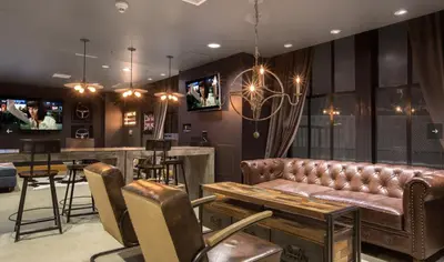 a living room with a couch and a bar at Furnished Studio Apartment in Los Angeles