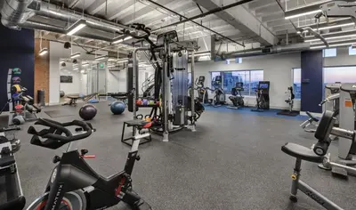 a gym with cardio equipment and exercise bikes at Furnished Studio Apartment in Los Angeles