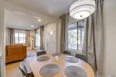 a dining room with a wooden table and chairs at Walkable Home Base Near LLUMC and Campus! in Loma Linda