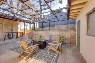 a patio with four chairs and a table at Walkable Home Base Near LLUMC and Campus! in Loma Linda