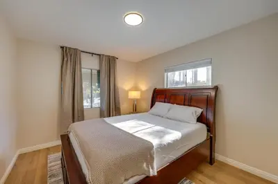a bedroom with a bed and a window at 1 Mi to LLUMC! Loma Linda Home with Shared Patio in Loma Linda