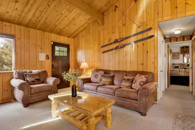a living room with two couches and a coffee table at Sweet Dream Cabin on Dream Street | Walk to Alpine Slide, Dining, & Big Bear Fun in Big Bear Lake