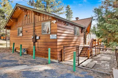 a log cabin with a ramp leading up to it at Sweet Dream Cabin on Dream Street | Walk to Alpine Slide, Dining, & Big Bear Fun in Big Bear Lake