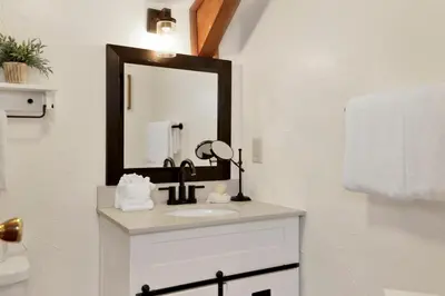 a bathroom with a sink and a mirror at Willow Bear Lodge: Shuttle Stop Pet-Friendly, Walk to the Lake | Book Your Big Bear Stay! in Big Bear Lake