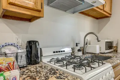 a kitchen with a stove and a sink at 5 Mi to Santa Monica Pier and Beach Chic Studio in Los Angeles