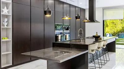 a kitchen with a black counter and a sink at Private LA Retreat w Pool Hot Tub Fire Pit Near Melrose Ave The Martel House by AvantStay in Los Angeles
