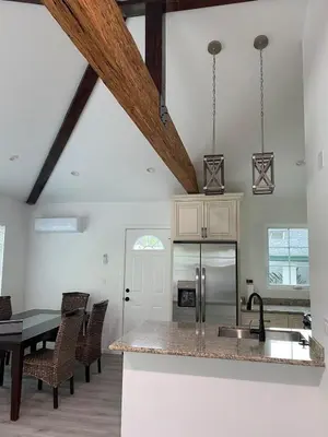 a kitchen and dining room with a table and a counter at 530 sq ft Mini House in Walnut in Walnut