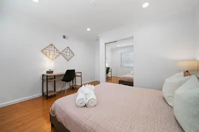 a bedroom with a bed with two towels on it at Marbella Lane - Serene & Spacious 3BR Haven in West Covina