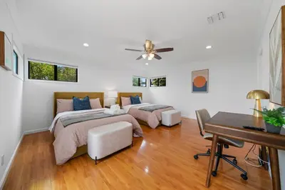 a bedroom with two beds and a desk and a piano at Marbella Lane - Your Cozy Haven 2BR Retreat in West Covina