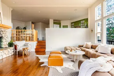 a living room with a couch and a table at Lakeview Mountain Modern in Lake Arrowhead