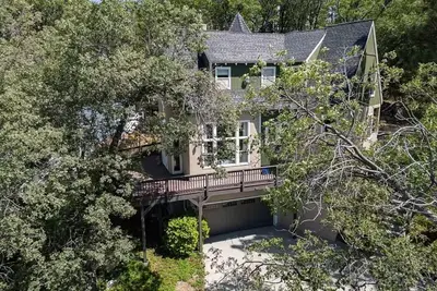 an aerial view of a house with a balcony at Lakeview Mountain Modern in Lake Arrowhead