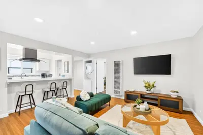 a living room with a couch and a table at Prime Manhattan Beach 2BR Walk to Beach with Parking in Manhattan Beach