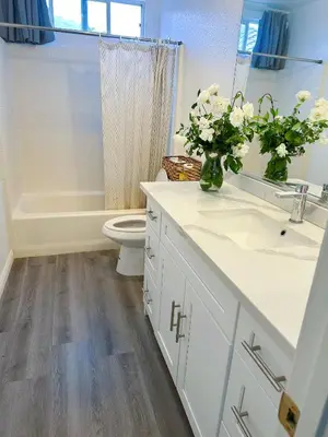 a bathroom with a sink and a toilet and a tub at Big quiet bedroom in Hacienda Heights