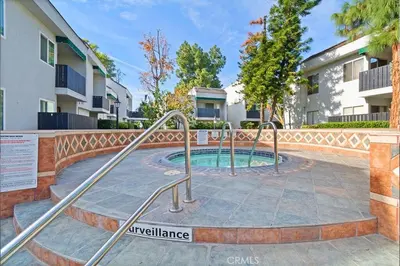 a small pool in a courtyard in front of a building at A Tranquil Retreat in Tarzana CA in Tarzana