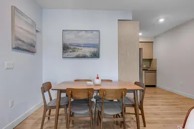 a kitchen and dining room with a table and chairs at Brand New 2BR Loft near Universal & Hollywood in Los Angeles