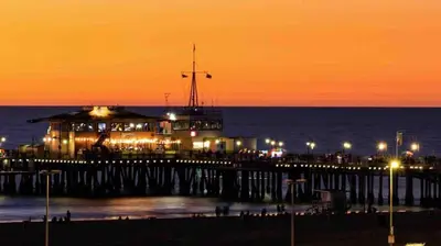 a pier with lights on the ocean at night at Beach lovely home in Santa Monica in Los Angeles