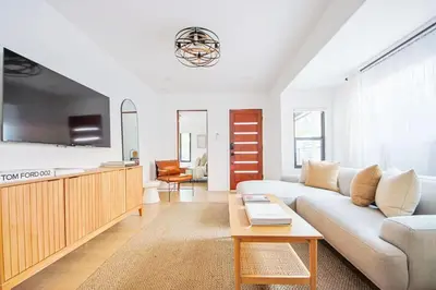 a living room with a couch and a table at 2 Units Oasis Villa w terrace&roofdeck 12 pax in Los Angeles