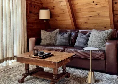 a living room with a couch and a coffee table at The Highpoint - Close to Lake/Village, Fireplace, Smart TV, Hammock, BBQ in Big Bear Lake